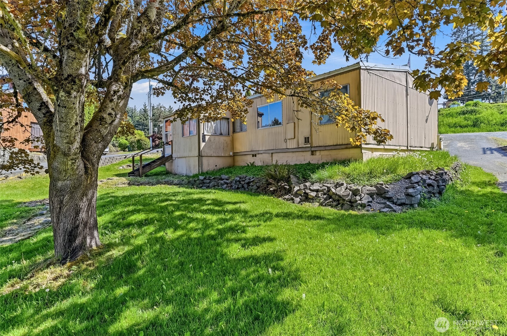 32711 Commission Avenue Black Diamond, WA 98010 - Photo 20 of 34 a view of a house with a yard