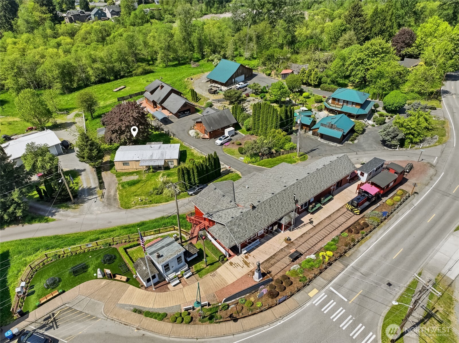 32711 Commission Avenue Black Diamond, WA 98010 - Photo 28 of 34 an aerial view of a house with a yard basket ball court and outdoor seating
