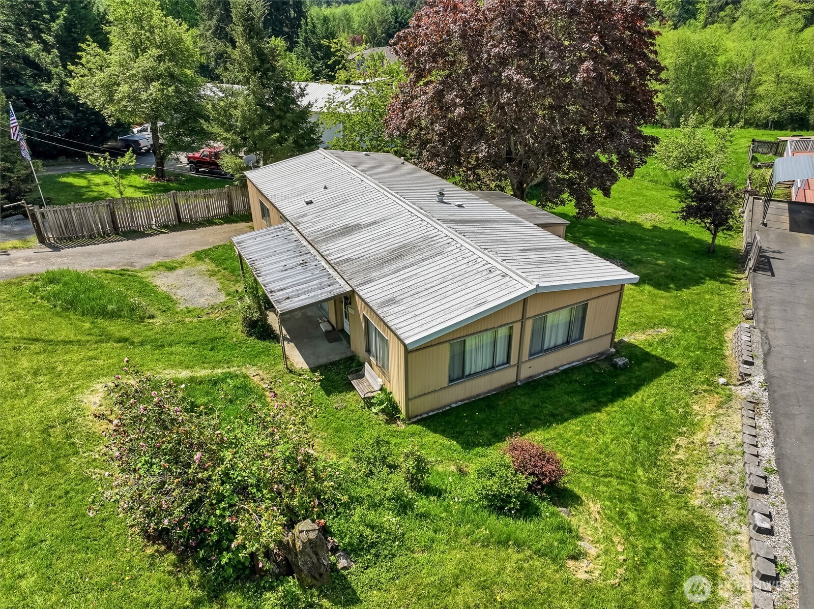 32711 Commission Avenue Black Diamond, WA 98010 - Photo 33 of 34 a aerial view of a house with a yard table and chairs