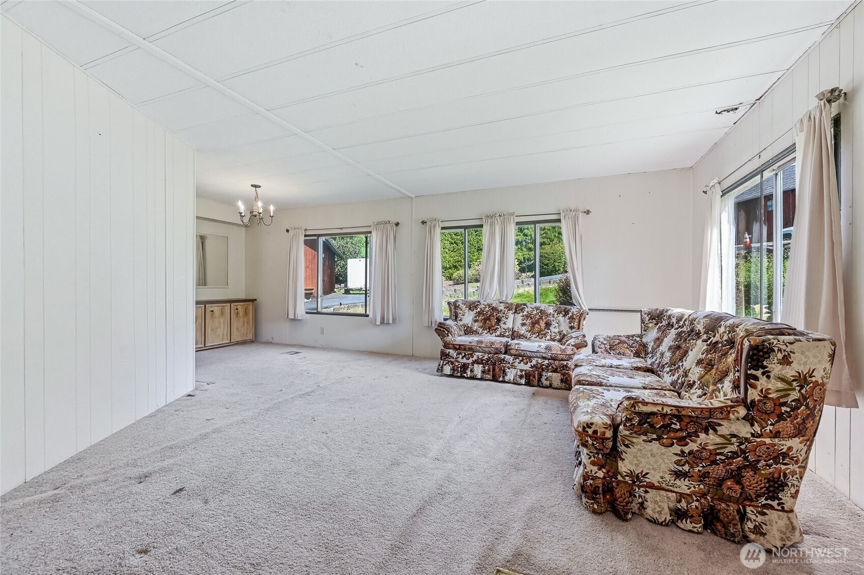 32711 Commission Avenue Black Diamond, WA 98010 - Photo 6 of 34 a living room with furniture and large windows