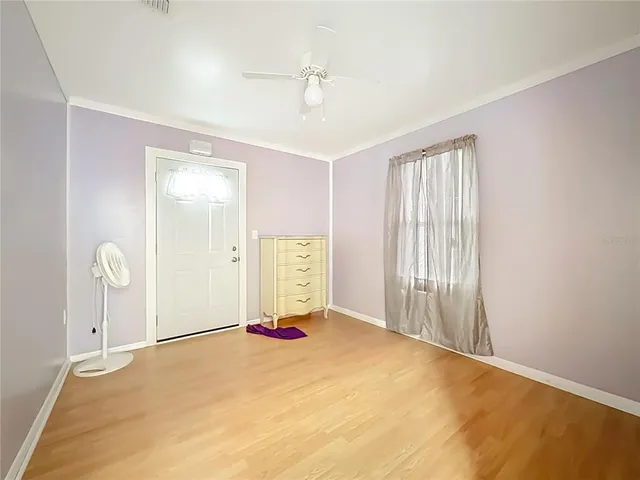 a view of livingroom with hardwood floor and a ceiling fan
