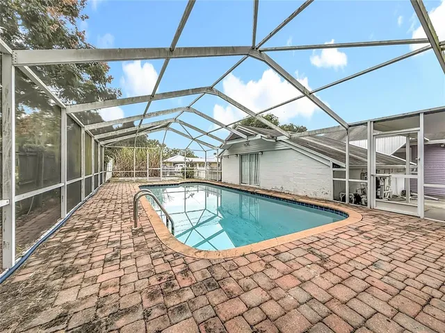 a view of a livingroom with furniture and a window