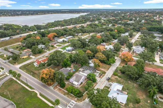 an aerial view of a house with a yard