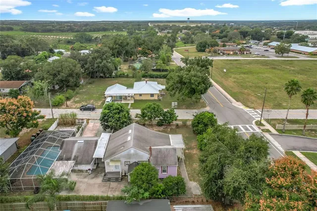 an aerial view of residential houses with outdoor space