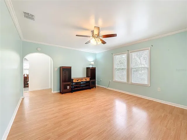 a view of livingroom with furniture and chandelier fan