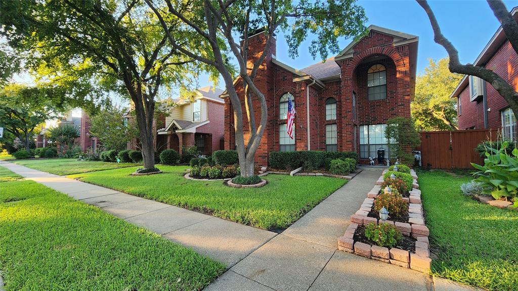 Traditional home with brick siding and a chimney