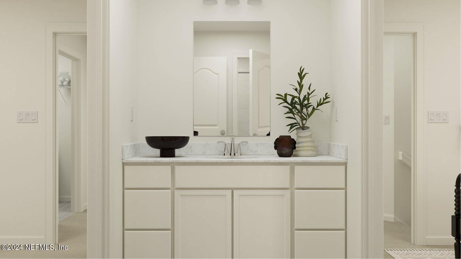 745 Lake Sinclair Street St. Augustine, FL 32084 - Photo 6 of 19 a bathroom with a sink and a mirror