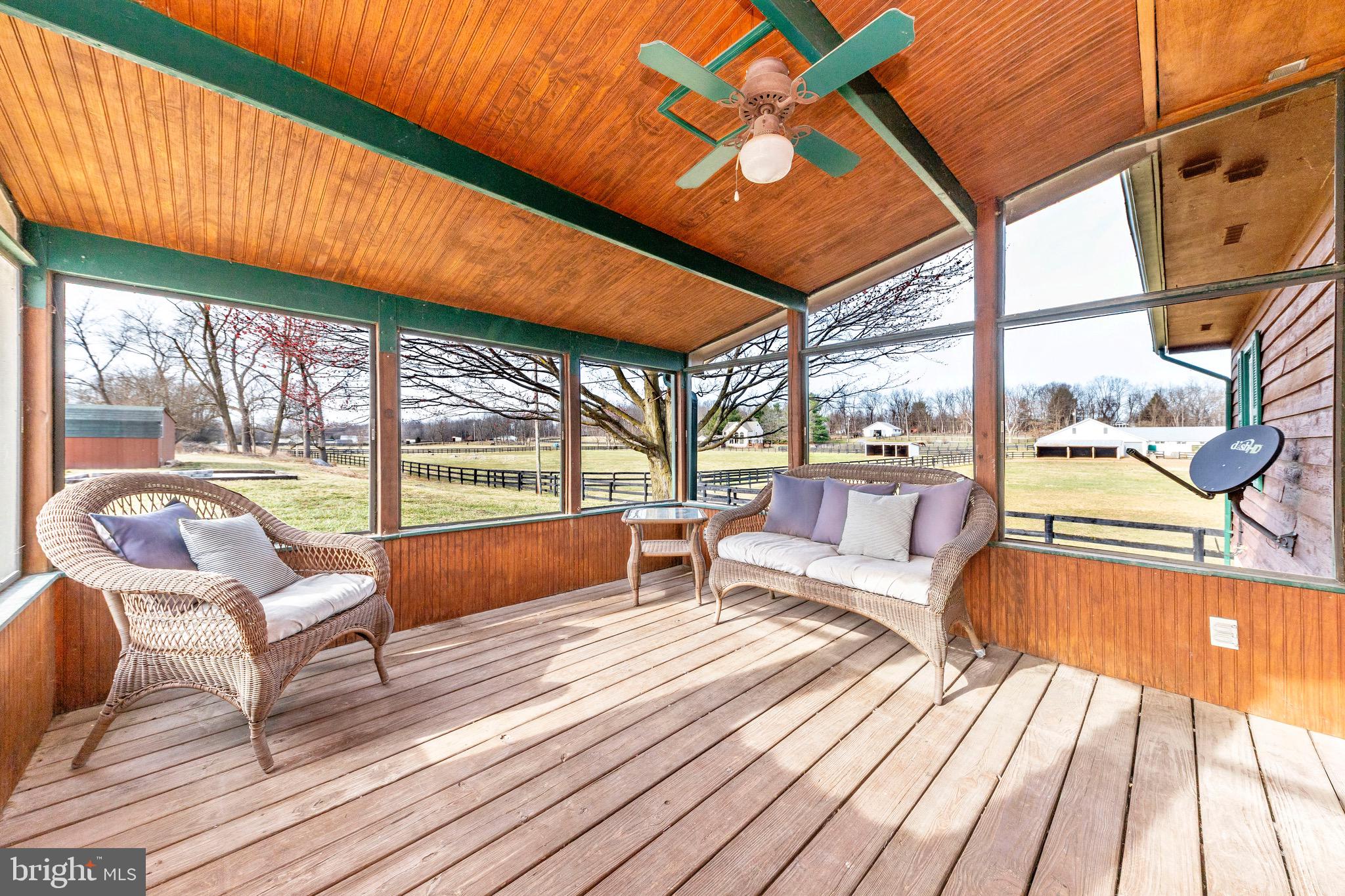 54 Stony Lane Ranson, WV 25438 - Photo 23 of 31 a living room with large windows and wooden floor