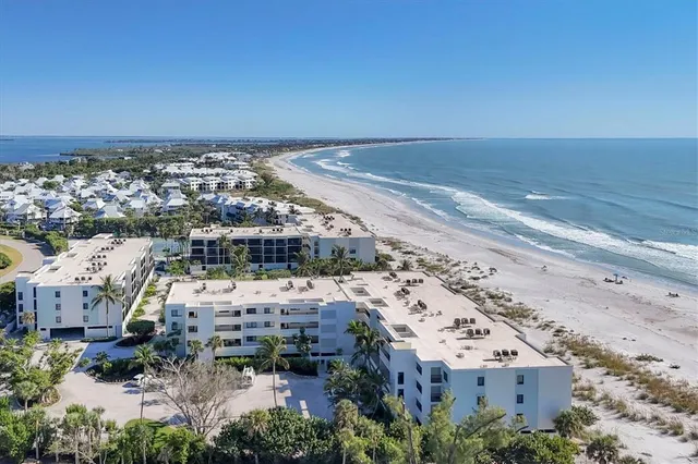 an aerial view of a building with beach