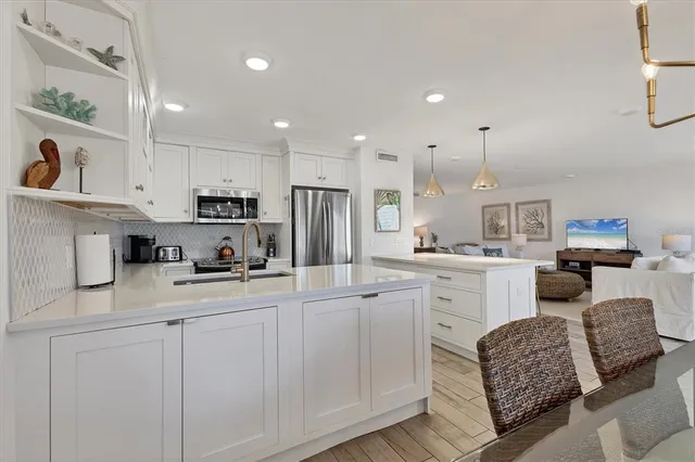 a kitchen with sink cabinets and window