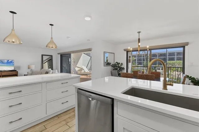 a dining room with furniture a window and kitchen view
