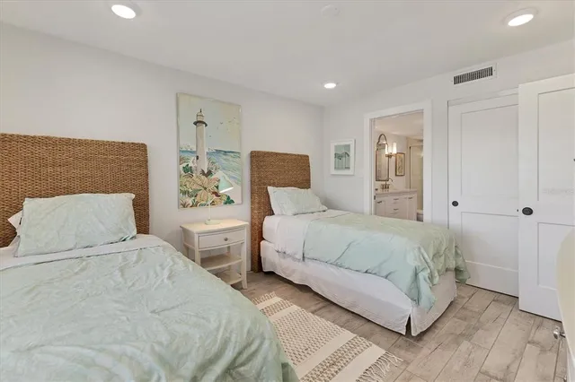 a room with white cabinets and white appliances