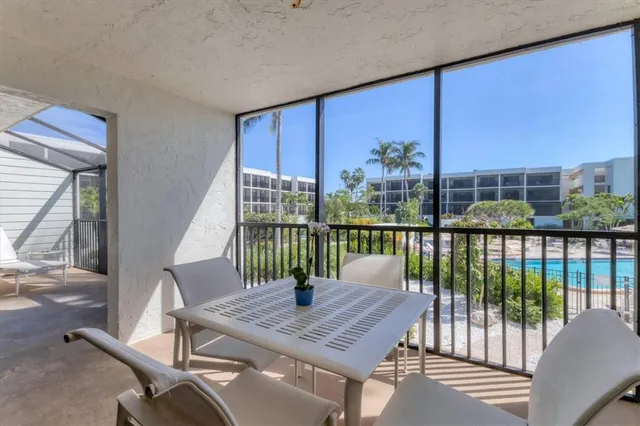 a view of tall trees from a balcony