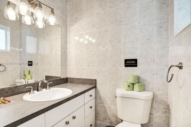 a bedroom with two beds and a window