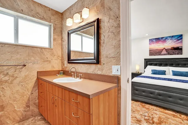 a bathroom with a sink vanity and a mirror