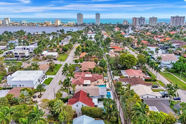 an aerial view of residential houses with outdoor space