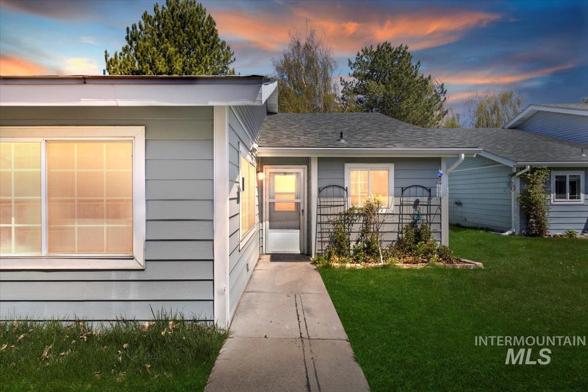 313 1/2 6th Street Filer, ID 83328 - Photo 1 of 1 View of front of house with a yard and a shingled roof