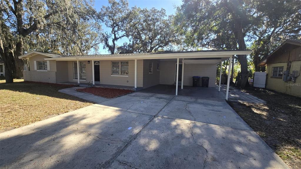 5716 Deerfield Road Orlando, FL 32808 - Photo 1 of 1 a view of a house with a yard