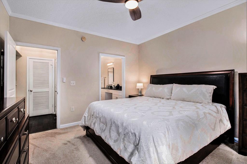 10 Perimeter Summit Boulevard, Unit 2112 Atlanta, GA 30319 - Photo 19 of 40 a bedroom with a bed and a television