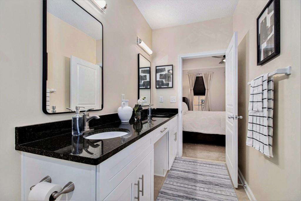 10 Perimeter Summit Boulevard, Unit 2112 Atlanta, GA 30319 - Photo 20 of 40 a kitchen with a sink and a refrigerator