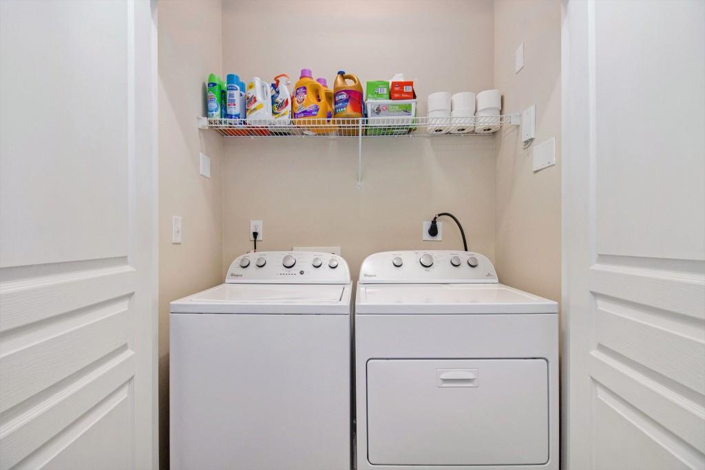 10 Perimeter Summit Boulevard, Unit 2112 Atlanta, GA 30319 - Photo 26 of 40 a utility room with dryer and washer