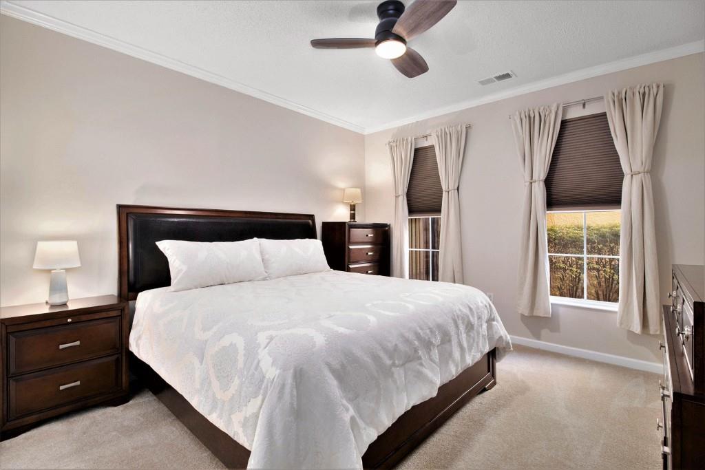 10 Perimeter Summit Boulevard, Unit 2112 Atlanta, GA 30319 - Photo 4 of 40 a bedroom with a large bed and a closet