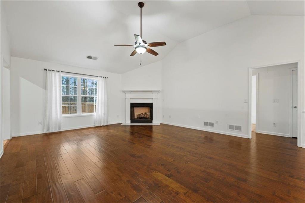 1218 Morgans Run Monroe, GA 30656 - Photo 29 of 39 a view of empty room with wooden floor and fan