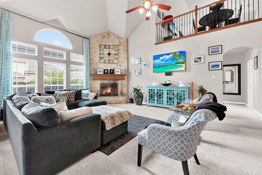128 Chestnut Lane Red Oak, TX 75154 - Photo 13 of 28 a living room with furniture fireplace and a large window