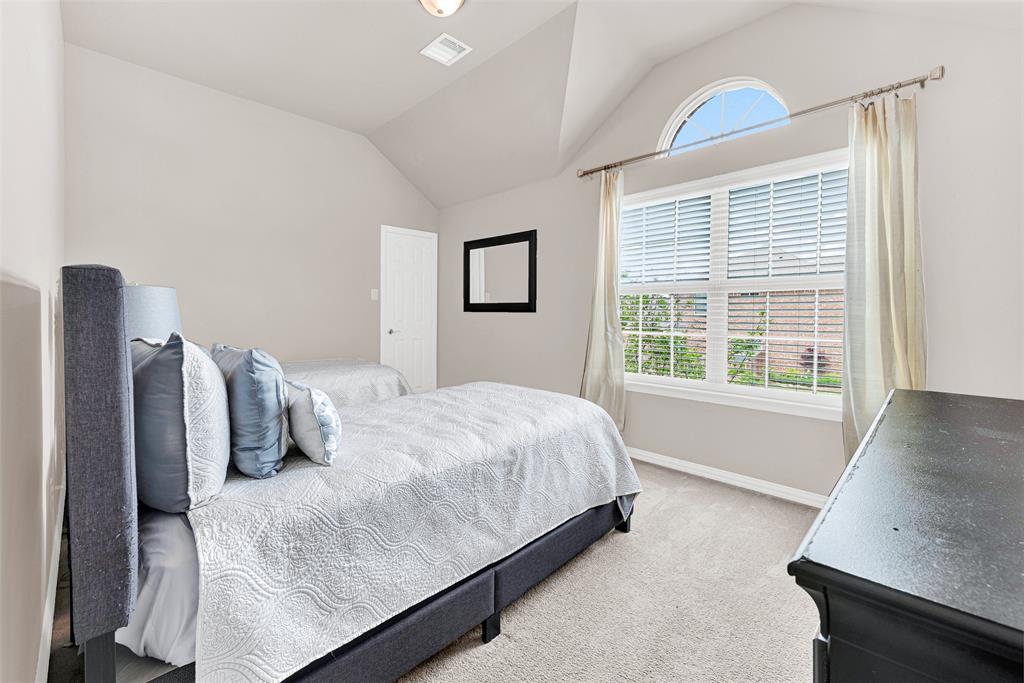 128 Chestnut Lane Red Oak, TX 75154 - Photo 19 of 28 a bedroom with a bed and wooden floor