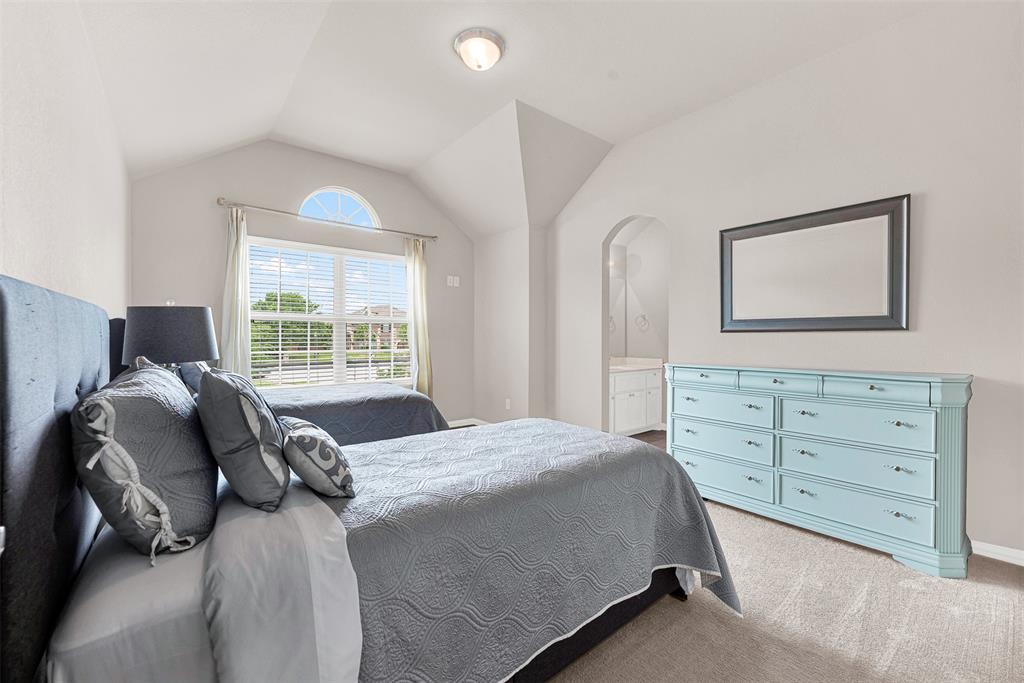 128 Chestnut Lane Red Oak, TX 75154 - Photo 20 of 28 a bedroom with a bed and a window