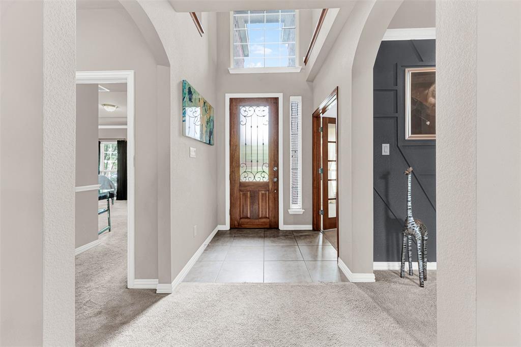 128 Chestnut Lane Red Oak, TX 75154 - Photo 2 of 28 wooden floor with a chandelier and a glass door