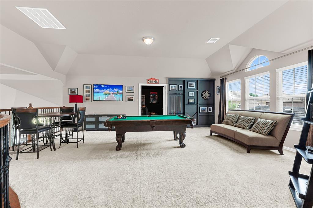 128 Chestnut Lane Red Oak, TX 75154 - Photo 22 of 28 a living room with furniture a pool table and a large window