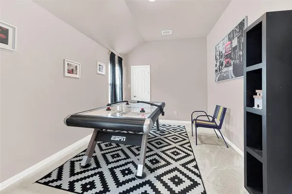 a view of a hallway with seating area