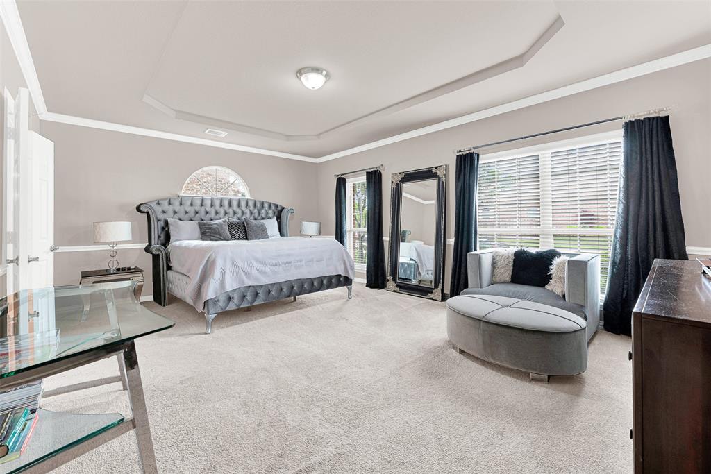 128 Chestnut Lane Red Oak, TX 75154 - Photo 4 of 28 a bedroom with a bed and a large window