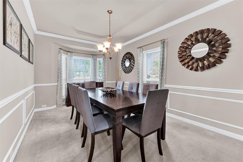 128 Chestnut Lane Red Oak, TX 75154 - Photo 8 of 28 a view of a dining room and a table and chairs