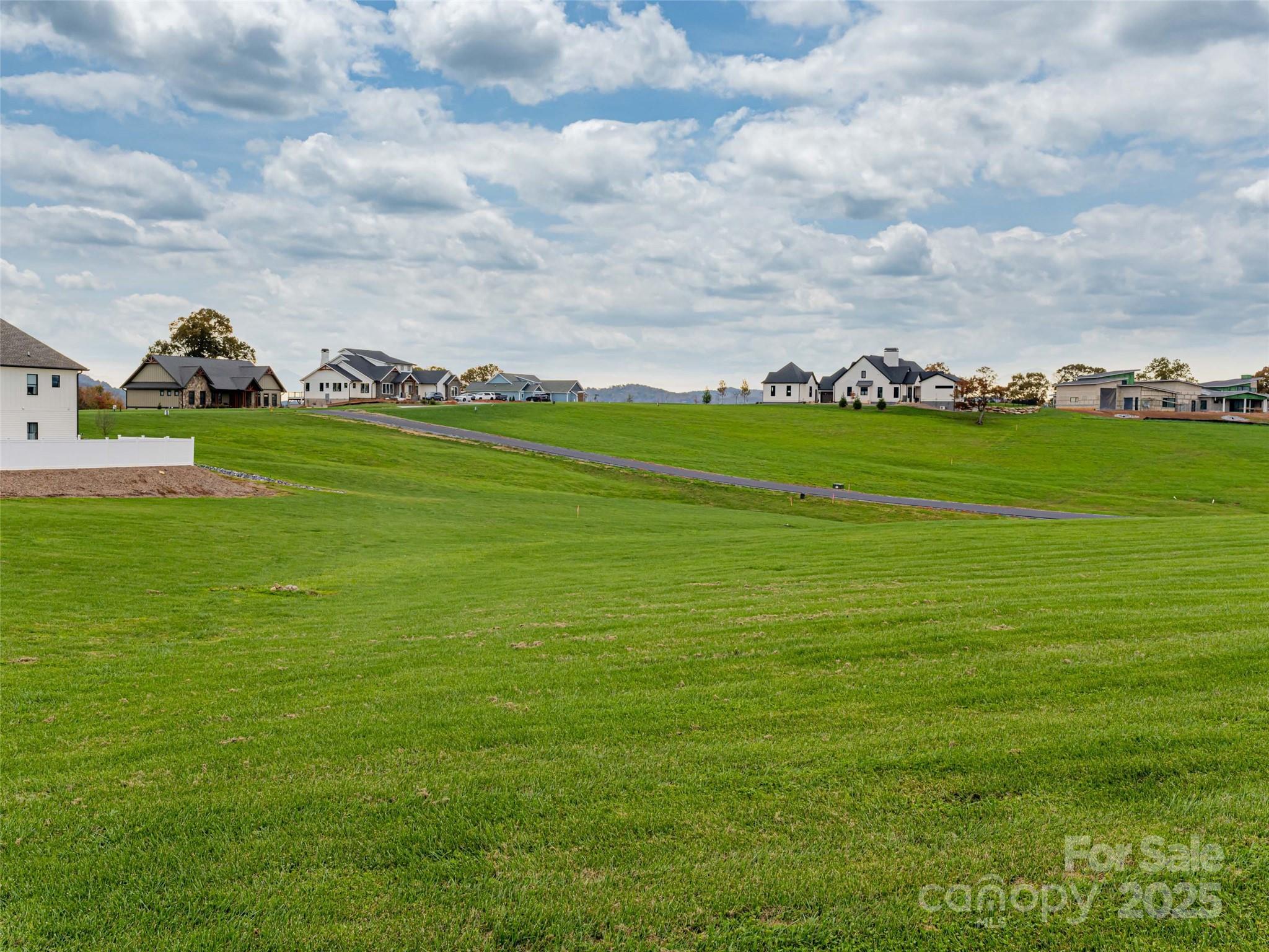 265 Majestic Ridge Road, Unit 61 Mills River, NC 28759 - Photo 4 of 7 a view of an ocean and houses