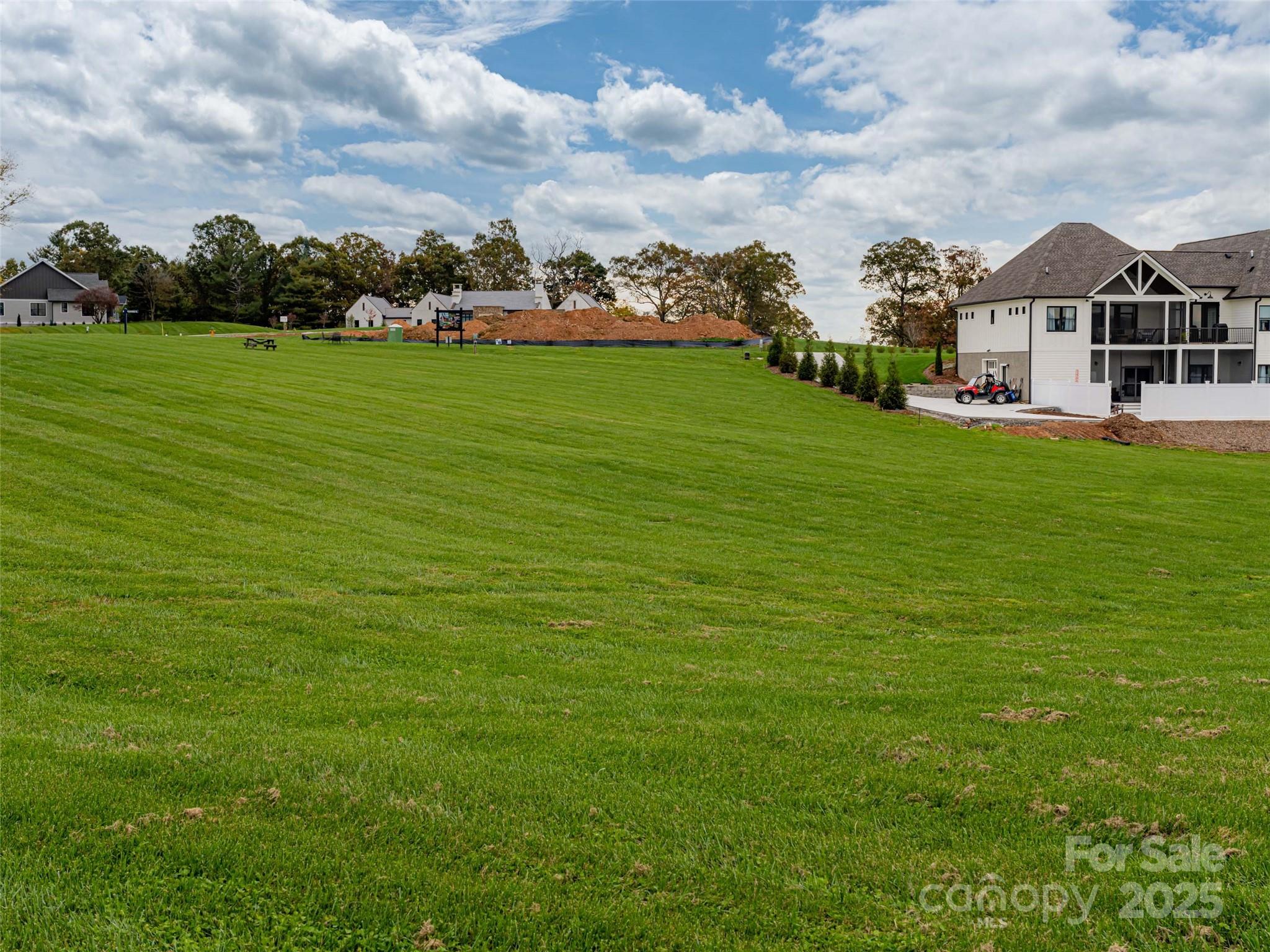 265 Majestic Ridge Road, Unit 61 Mills River, NC 28759 - Photo 6 of 7 a view of a big yard with plants and large trees