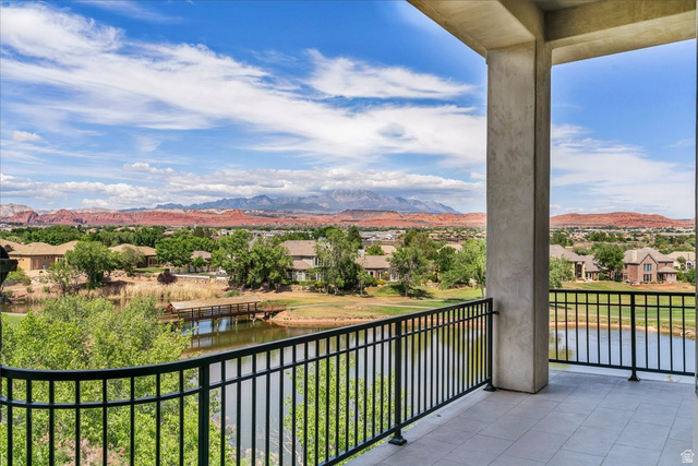 2608 Canyon Ridge Drive St. George, UT 84770 - Photo 49 of 86 Spacious balcony featuring a tiled floor, robust support columns, and an elegant wrought iron railing