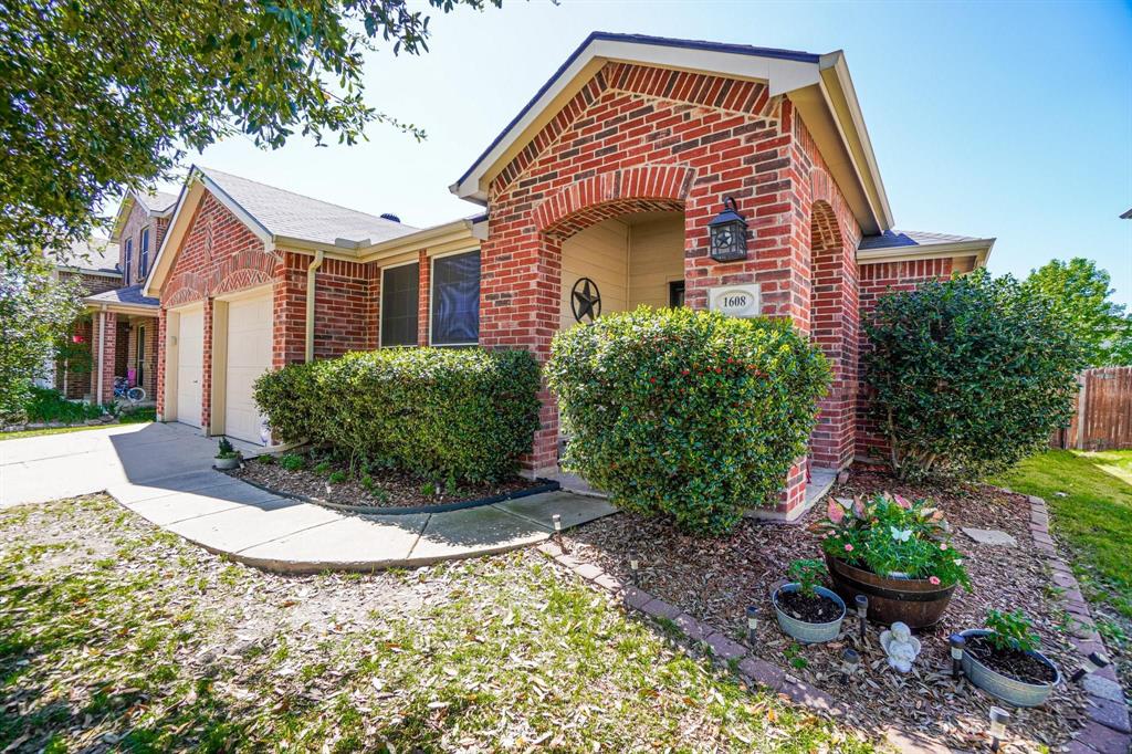 1608 Cardinal Way Aubrey, TX 76227 - Photo 1 of 1 a front view of a house with garden