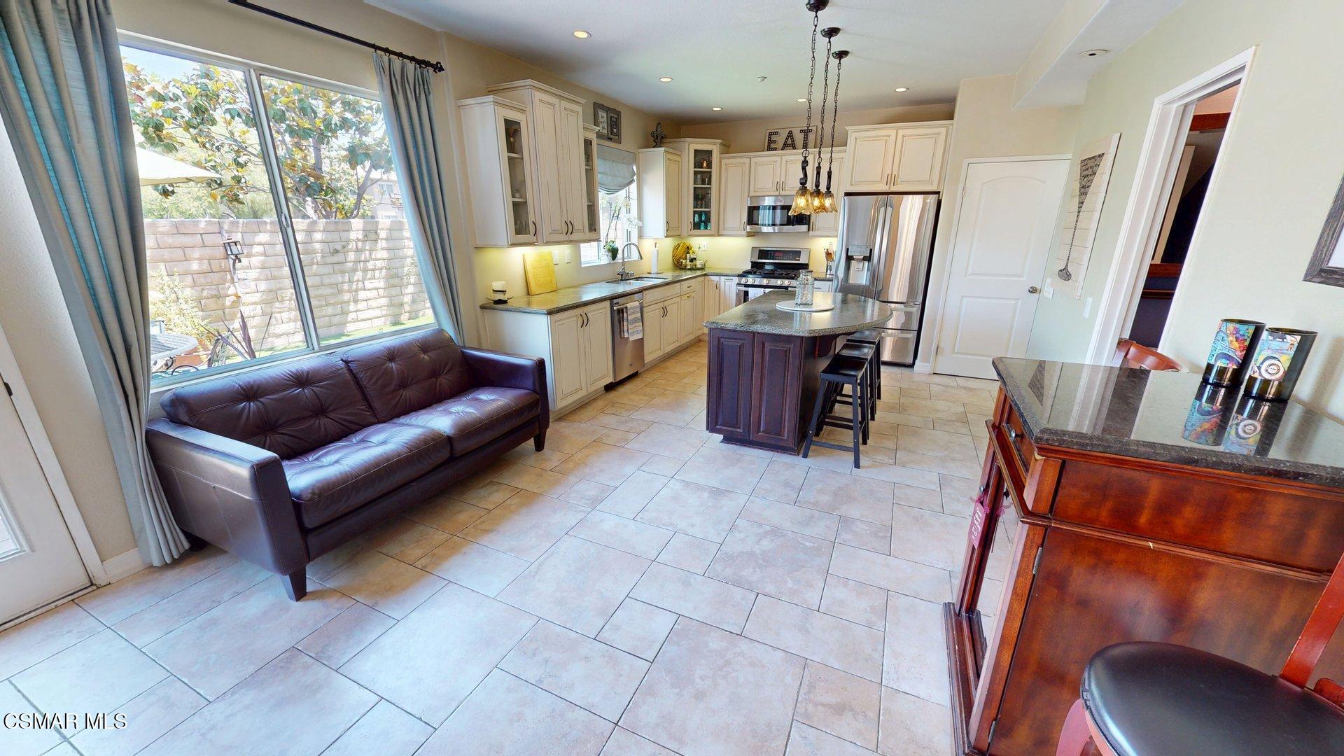 293 Springmist Lane Simi Valley, CA 93065 - Photo 12 of 50 a living room with stainless steel appliances granite countertop furniture and a fireplace