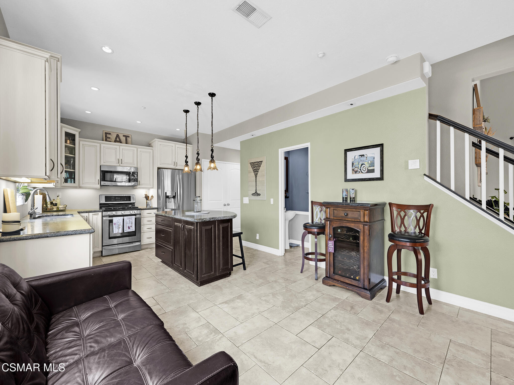 293 Springmist Lane Simi Valley, CA 93065 - Photo 13 of 50 a large living room with stainless steel appliances kitchen island granite countertop furniture