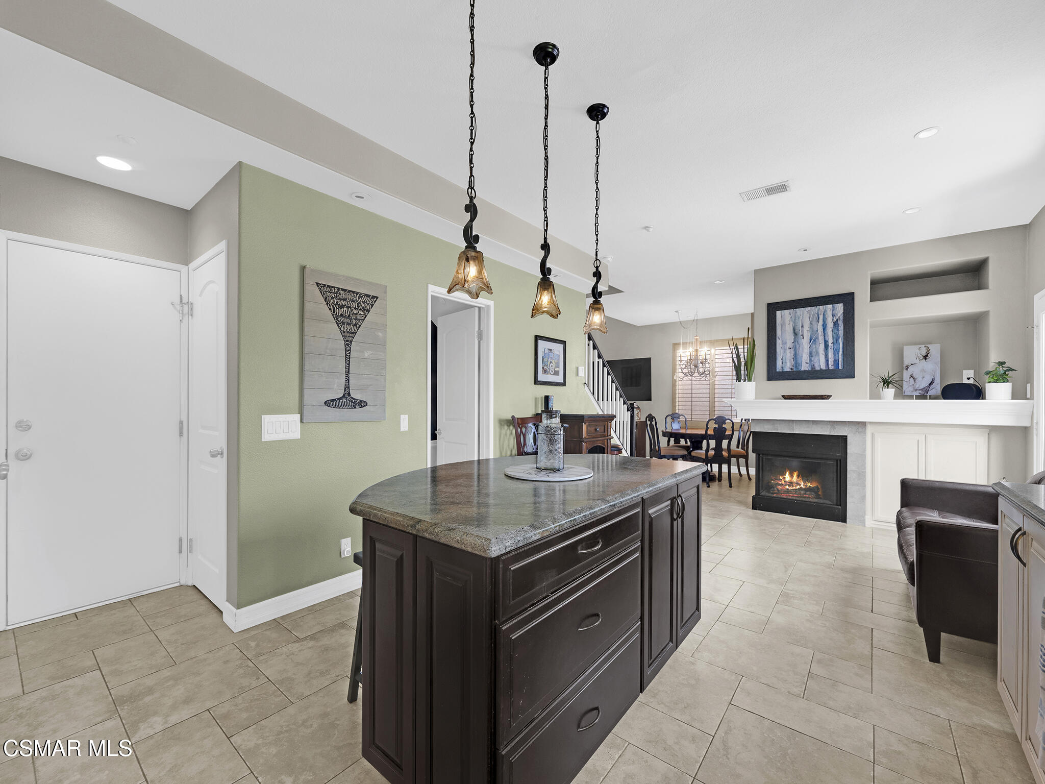 293 Springmist Lane Simi Valley, CA 93065 - Photo 19 of 50 a kitchen with stainless steel appliances granite countertop a stove a sink a oven and a wooden floor