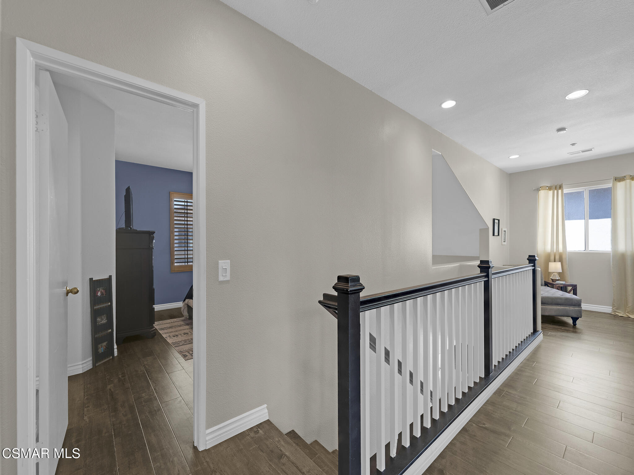 293 Springmist Lane Simi Valley, CA 93065 - Photo 24 of 50 a view of a hallway with bathroom and wooden floor