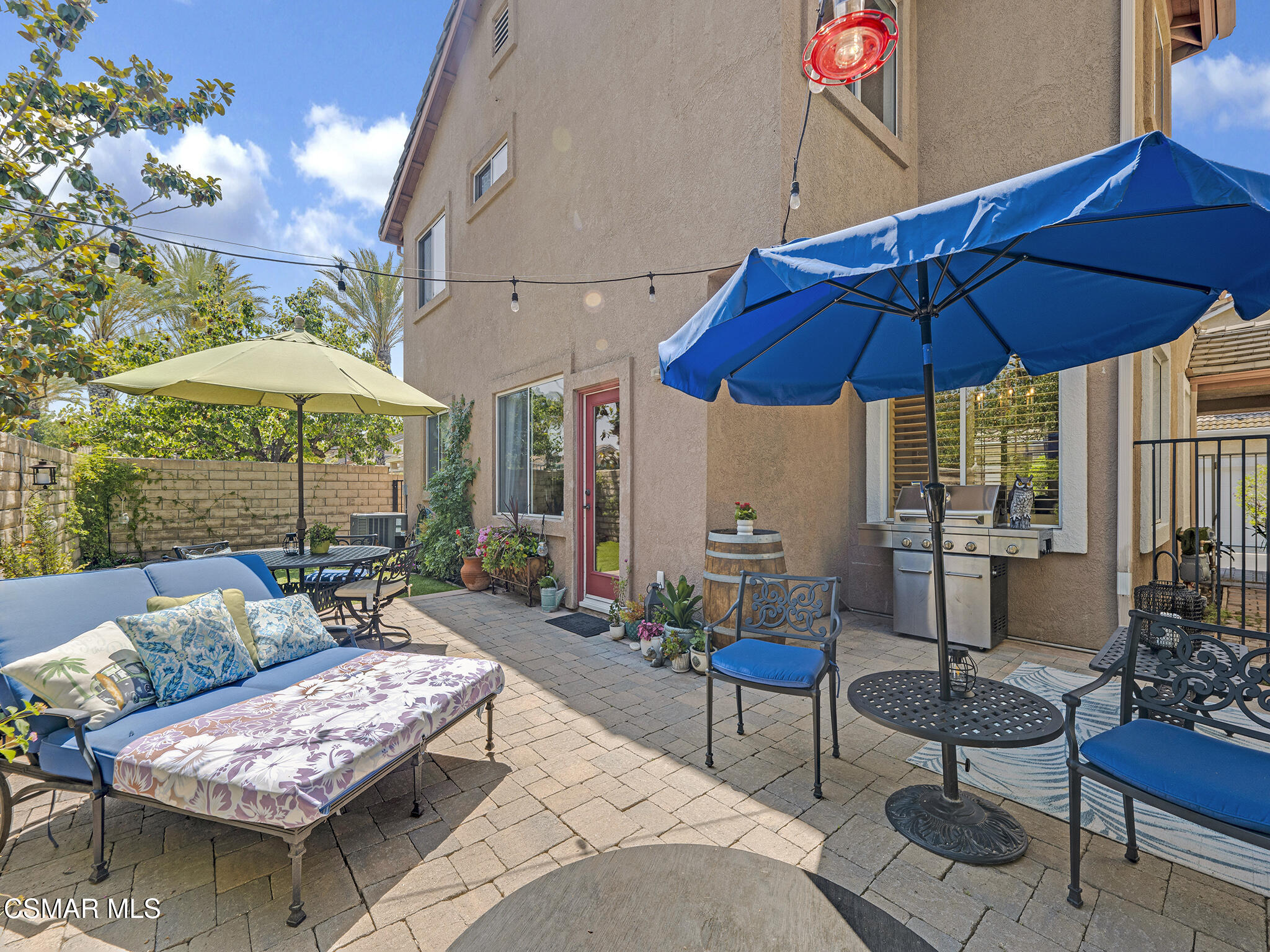 293 Springmist Lane Simi Valley, CA 93065 - Photo 33 of 50 a view of a patio with couches under an umbrella