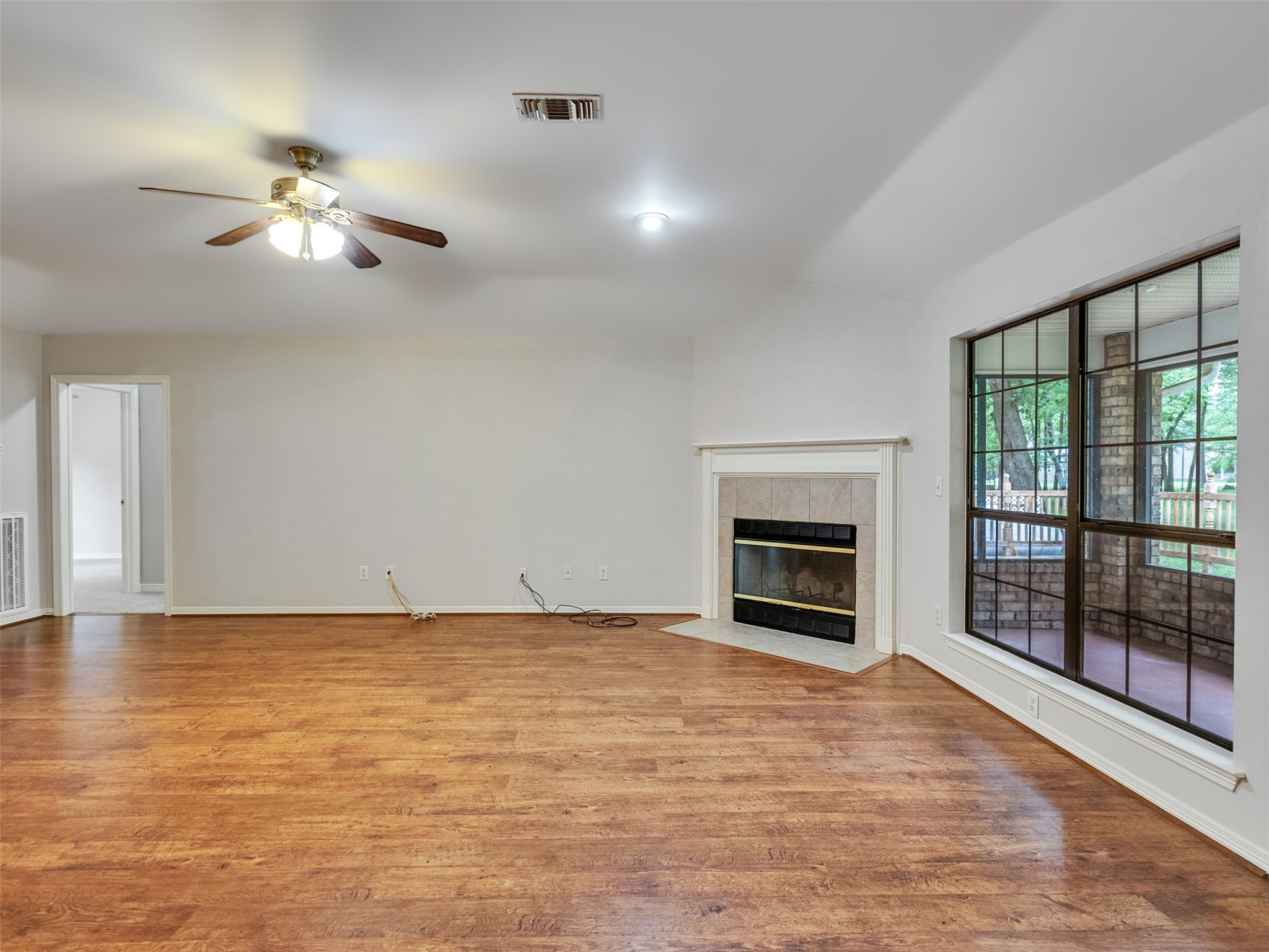 195 Coral Gables Trinity, TX 75862 - Photo 26 of 50 a view of empty room with fireplace and fan