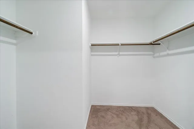 a bathroom with a granite countertop toilet a sink and a bathtub