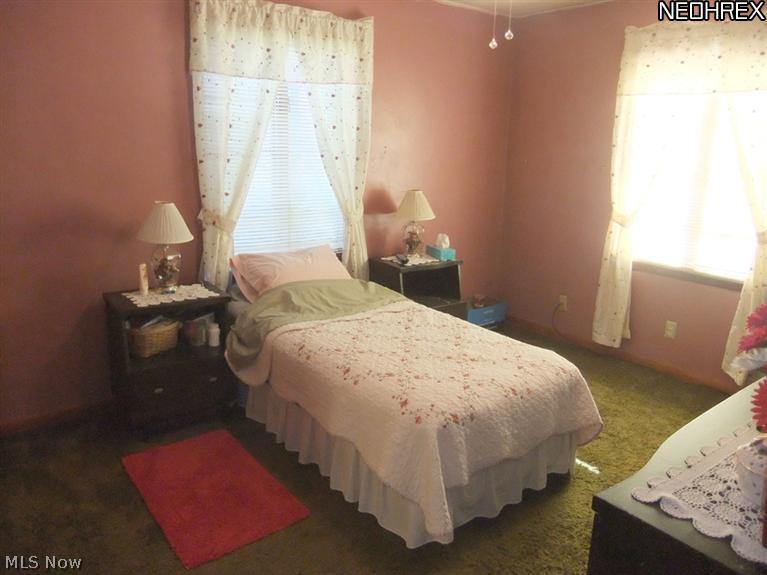1290 Jacoby Road Akron, OH 44321 - Photo 12 of 24 The spacious master bedroom provides a pretty view of the front yard...