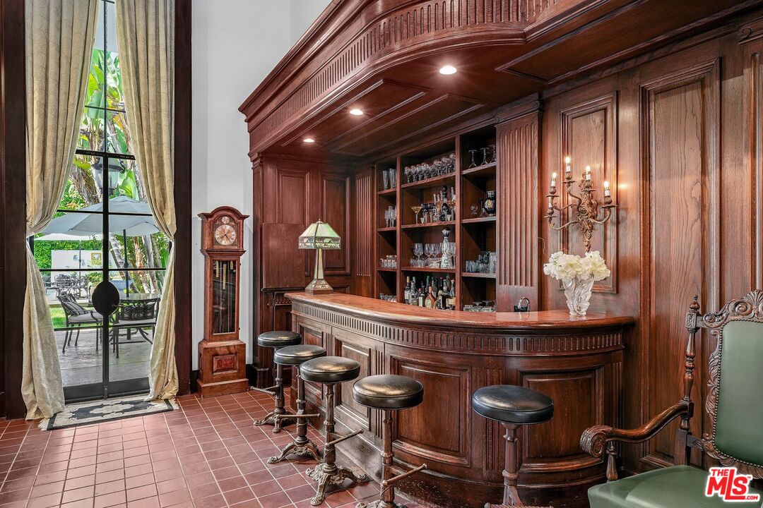 717 North Rodeo Drive Beverly Hills, CA 90210 - Photo 14 of 38 a view of a workspace with furniture and a window