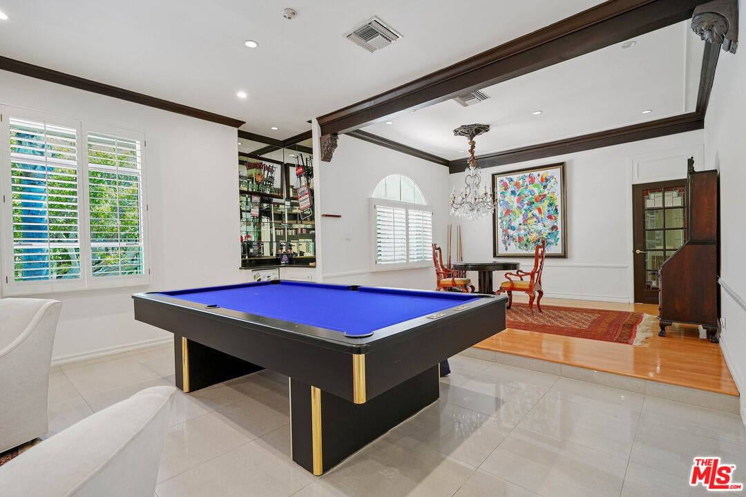 717 North Rodeo Drive Beverly Hills, CA 90210 - Photo 29 of 38 a front view of a house with pool table and windows