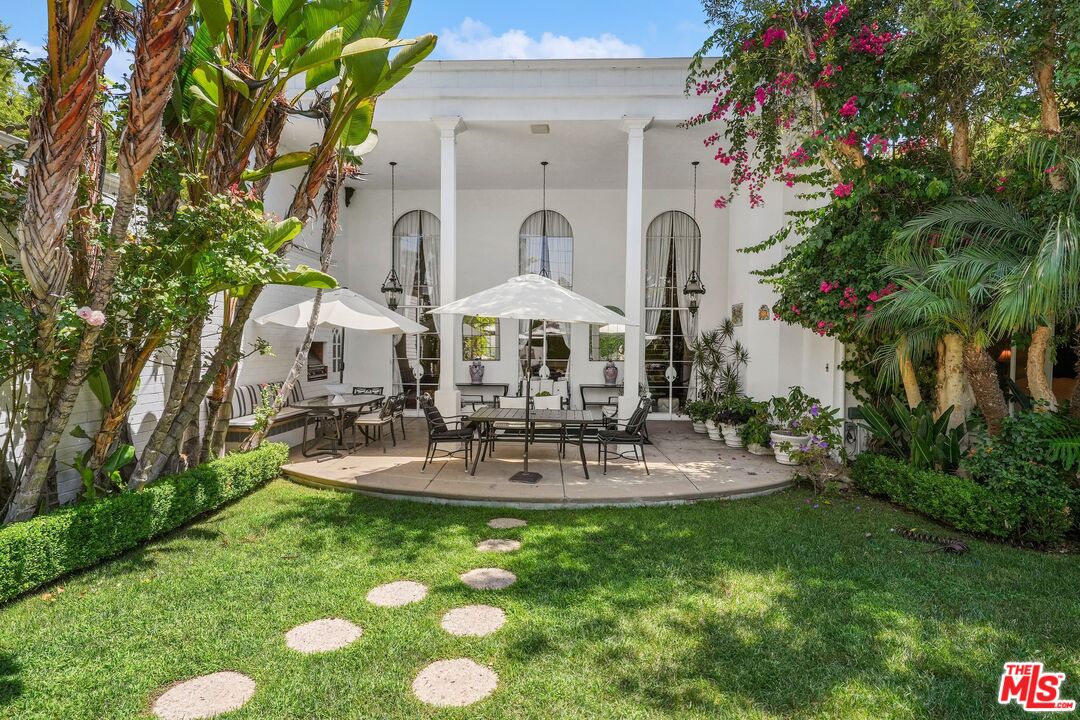 717 North Rodeo Drive Beverly Hills, CA 90210 - Photo 33 of 38 a view of house with backyard and outdoor seating